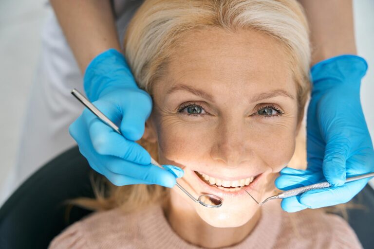 Checking Teeth And Dentures During A Dental Visit